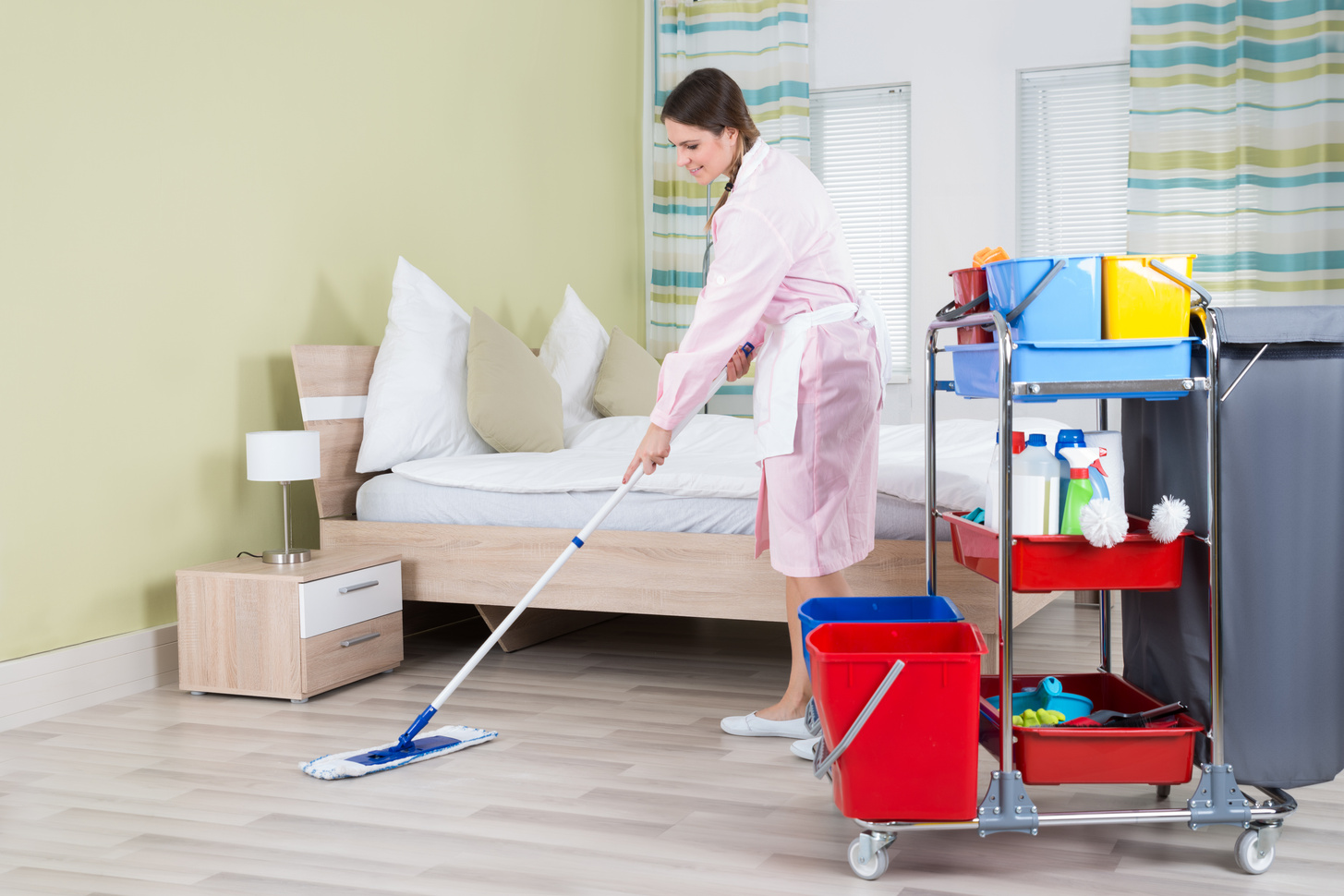 Female Housekeeper Mopping Floor